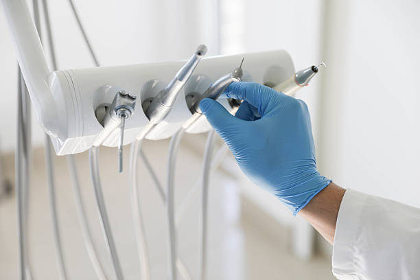 Professional Tooth Extraction technician working in Center Line, MI
